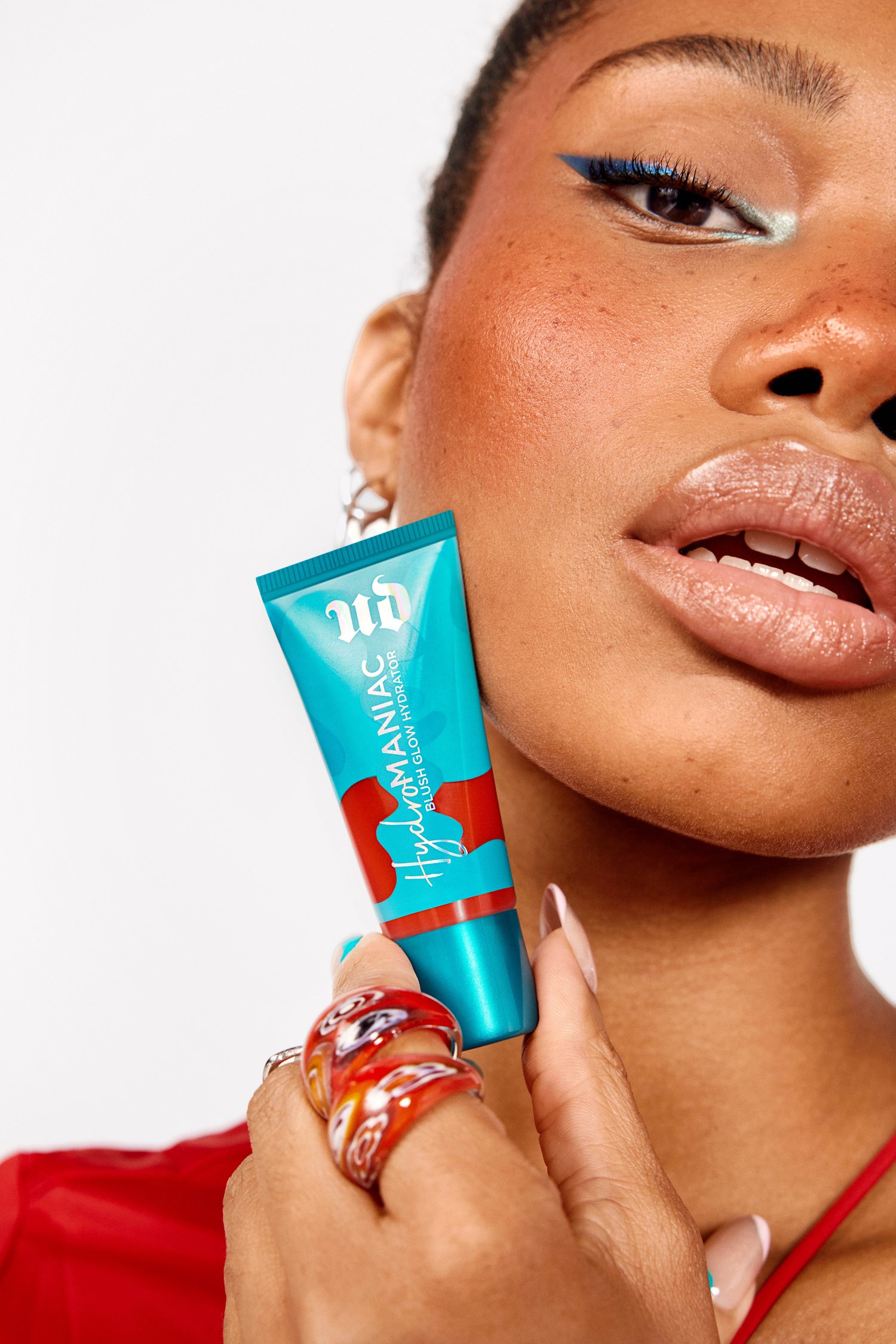 UD-HYDRO-BLUSH-CASSIE-HOLDING-PRODUCT-RED-FLAG-RGB